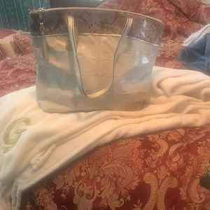 Signature Coach bag in Cream with snake skin trim with zipper closure